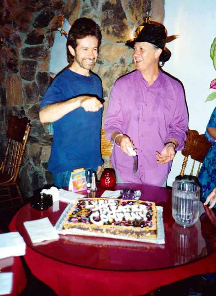 Christopher Riordan and George Chakiris with cake celebrating opening of Don Juan In Hell